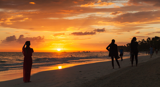 Punta Cana, Dominican Republic - January 5, 2017: Tourists are on sunrise beach of Punta Cana, Atlantic Ocean coast