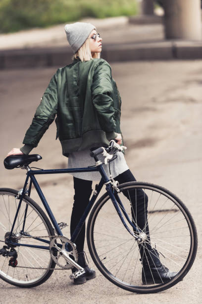 istock woman with vintage bicycle 886097604