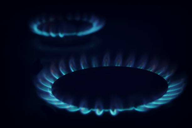 istock Gas burning in the burner over black background. 886097942