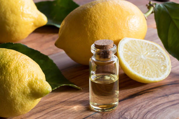 istock A bottle of lemon essential oil with fresh lemons 886107028