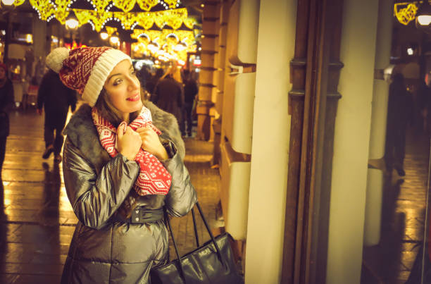 istock woman looking at shop window,christmas time 886109812