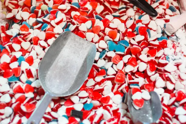 Selective focus, little heart shaped soft sugar jelly sweet on display at the Christmas market in Winter Wonderland