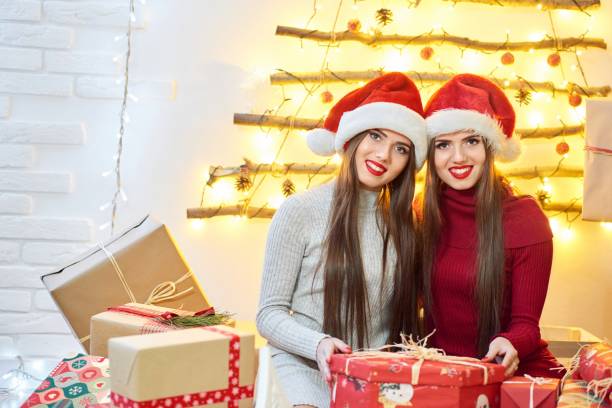 istock Beautiful twins in Christmas outfits 886115182