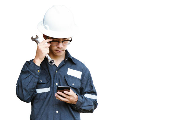 istock Asian man,Engineer or Technician in white helmet, glasses and blue working shirt suit holding smart phone, isolated on white, mechanic and Oil and Gas industrial concept with clipping path. 886122282