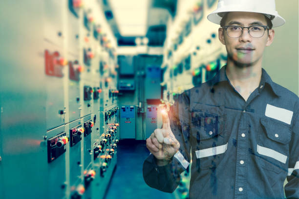 istock Double exposure of  Engineer or Technician man press his finger action in switch gear electrical room of oil and gas platform or plant industrial for monitor process, business and industry concept. 886122454
