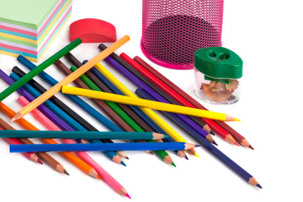 istock colored pencils in the basket, Eraser and pencil sharpener on white background 886122538