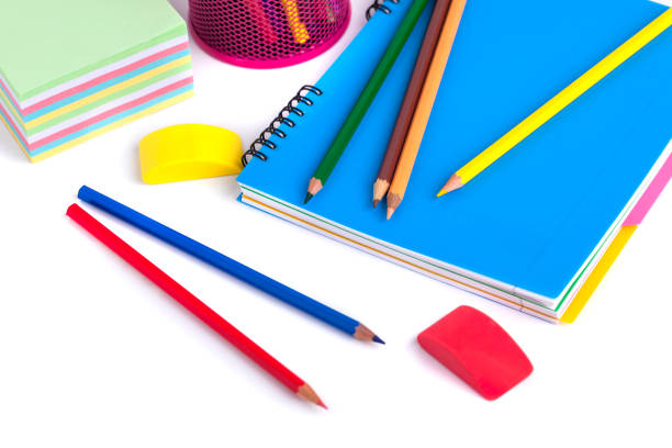 istock colored pencils in the basket, Eraser and pencil sharpener on white background 886122640