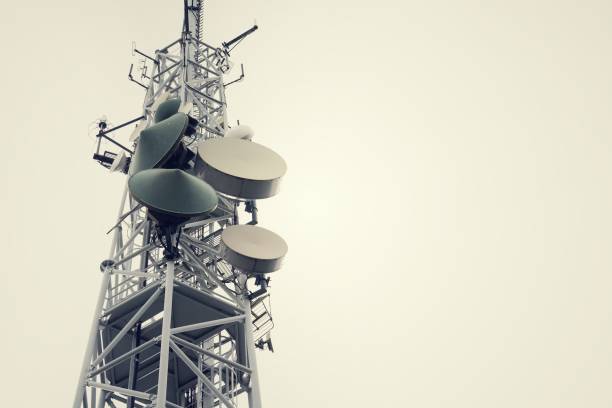 istock Low-angle vintage shot transmitters and aerials on telecommunication tower 886125488