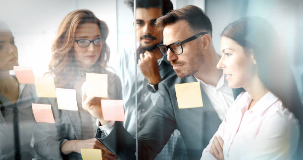 istock Corporate teamworking colleagues in modern office 886129228