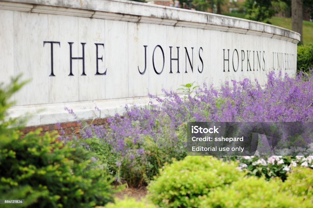 The Johns Hopkins University Sign Baltimore, Maryland, USA - July 25, 2016: Close up of sign for The Johns Hopkins University in Baltimore, Maryland.  Sign located on North Charles Street along the east gate to campus. Johns Hopkins University Stock Photo