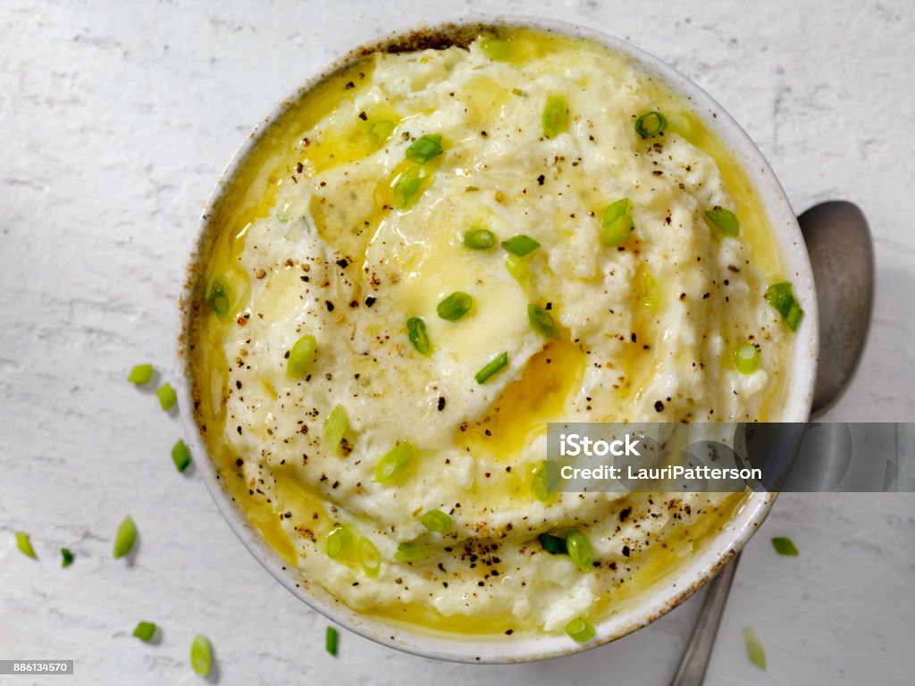 Creamy Mashed Cauliflower with Melted Butter Creamy Mashed Cauliflower with Melted Butter and Green Onions Mashed Potatoes Stock Photo