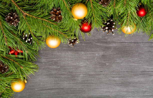 istock Christmas decoration, garland frame background, top view with copy space on black wood table 886134634