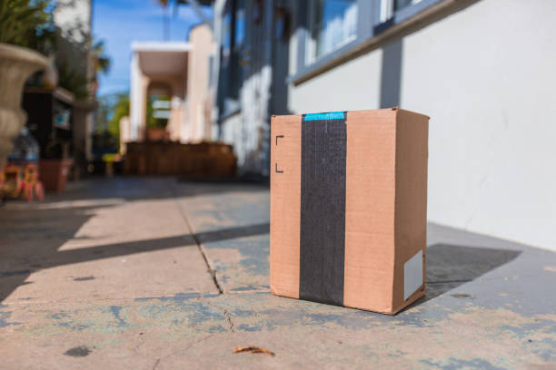 istock Cardboard package delivery at front door 886138188
