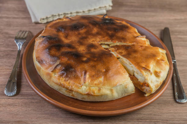 istock Galician empanada pie in a ceramic dish. The Spanish national dish. Close-up. 886151336