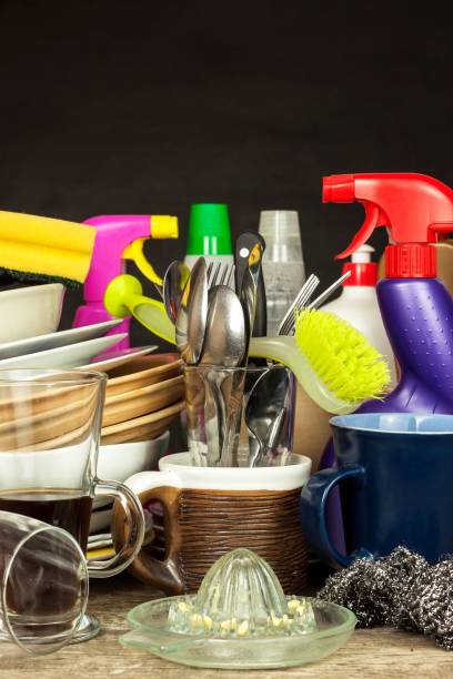 istock Washing kitchenware. Crockery on a wooden table. Cleaning after home celebration. Housework. 886152590