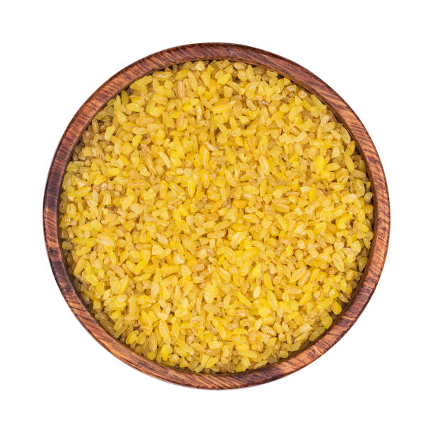 istock Bulgur wheat in plate isolated on white background, top view 886155356