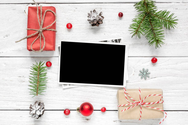 istock christmas blank photo card in frame made of fir tree branches, decorations and gift boxes 886156018