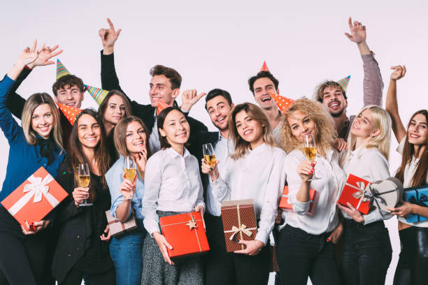 istock Group of people having a party with gift boxes. 886160566