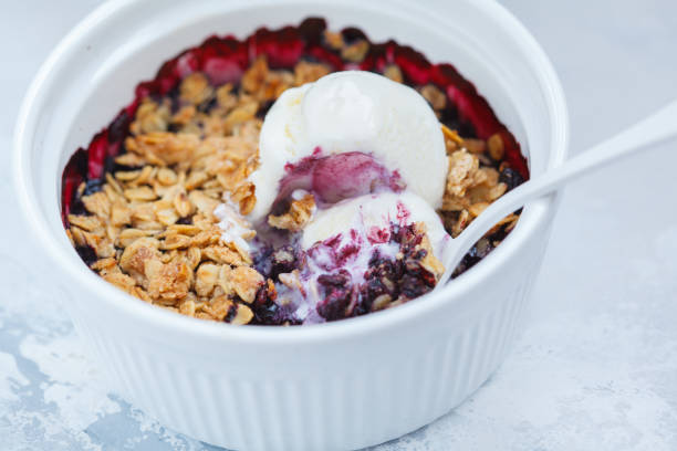 istock Berry crumble cake with cream ice-cream 886160660