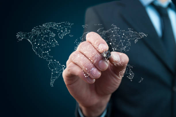 istock Business man hand pen and  touch screen with world map 886163312