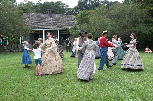Baton Rouge, Louisiana, USA - 2017: Actors dancing at LSU Rural Life Museum, an outdoor museum of Louisiana history.