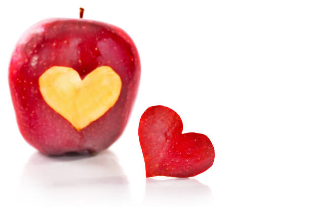 istock Red apple and the heart which is cut out from apple 886176210