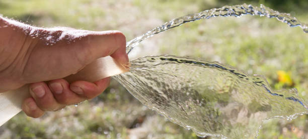 istock water from the hose outdoors 886176566