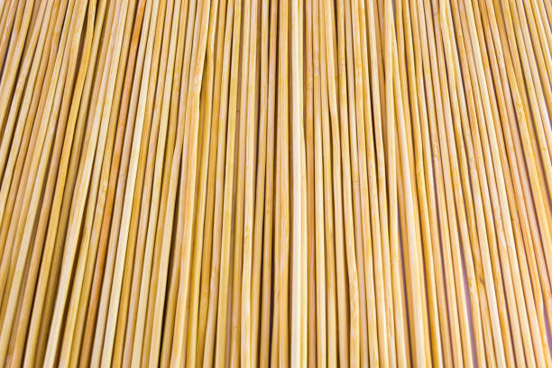 istock Wooden yellow bamboo mat texture abstract background. 886180166