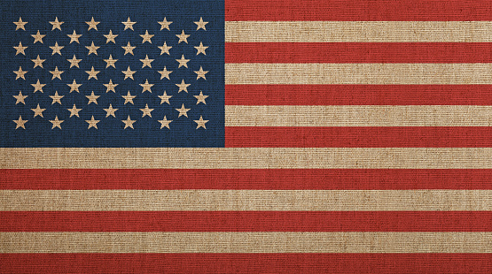 US national flag on stone wall background