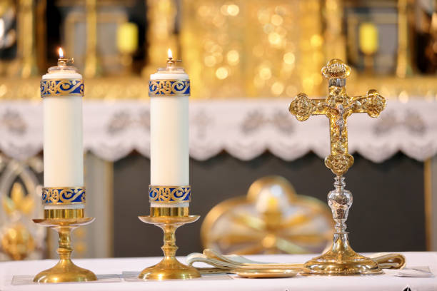 istock Golden cross on the altar with candles 886183204