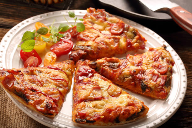 istock Homemade pizza on a white plate 886183842