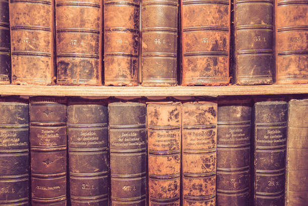 istock Old books on wooden shelf. 886186702