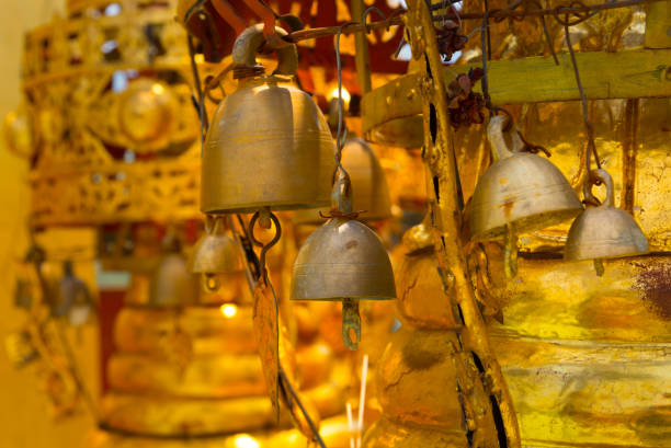 istock Old gold bell in buddhist temple. 886186752
