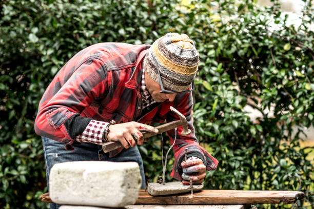istock Mid Adult Artist Man Sculpturing an Artwork 886186884