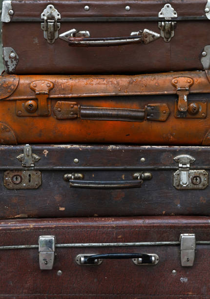 istock Stack of old vintage travel suitcases close up 886193720