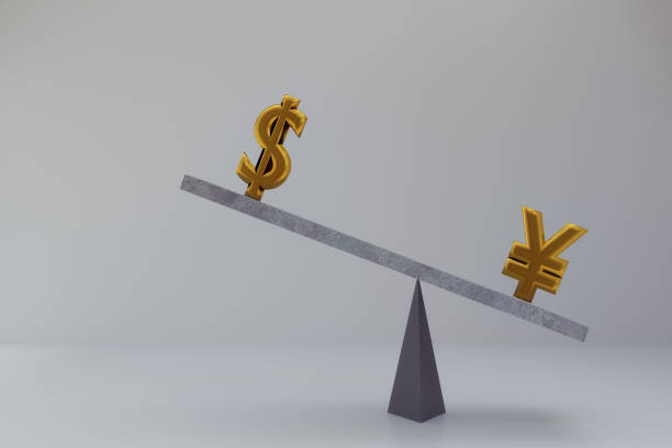 istock abstract Chinese Yuan and dollar on balance scale 886194448