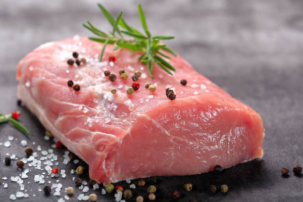 istock Raw pork loin with spices 886202086