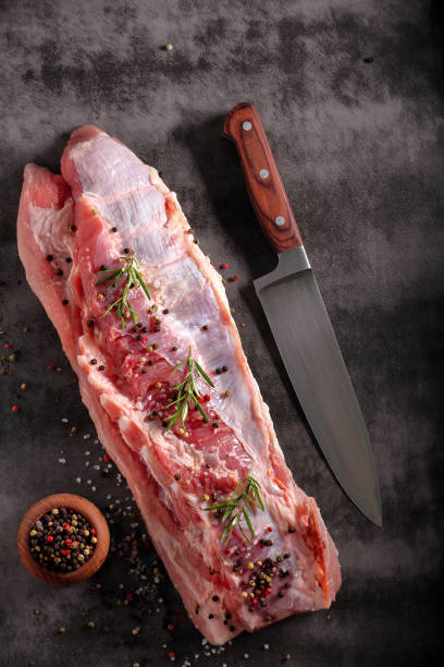 Raw ribs stone background