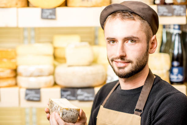 istock Cheese seller at the shop 886204980