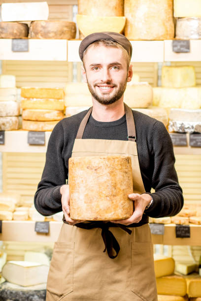 istock Cheese seller at the shop 886205100
