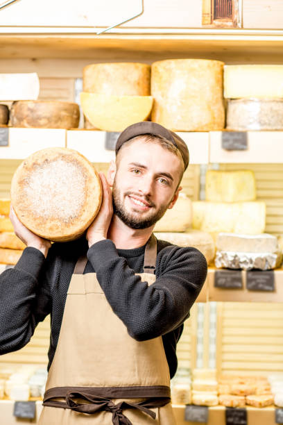 istock Cheese seller at the shop 886205142