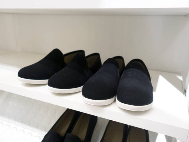 istock Shoe rack on a wooden floor 886205192