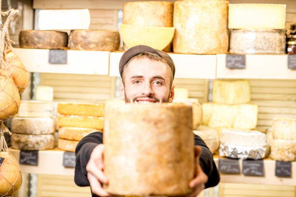 istock Cheese seller at the shop 886205248