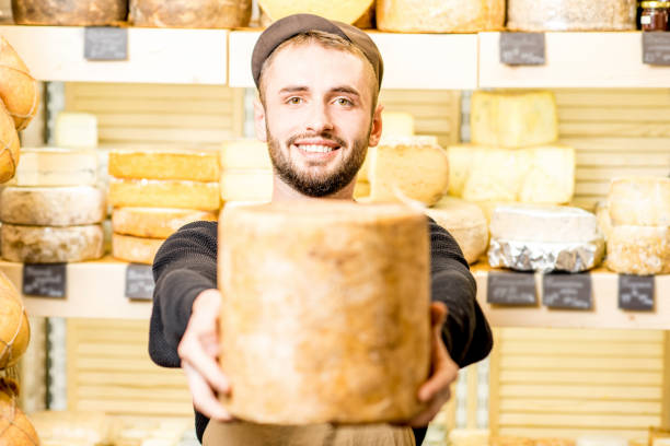 istock Cheese seller at the shop 886205276