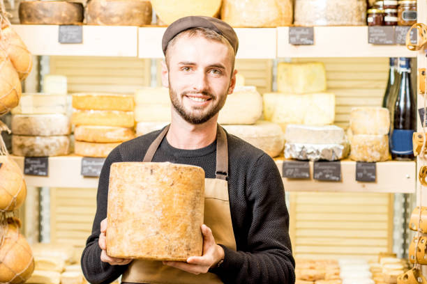 istock Cheese seller at the shop 886205378