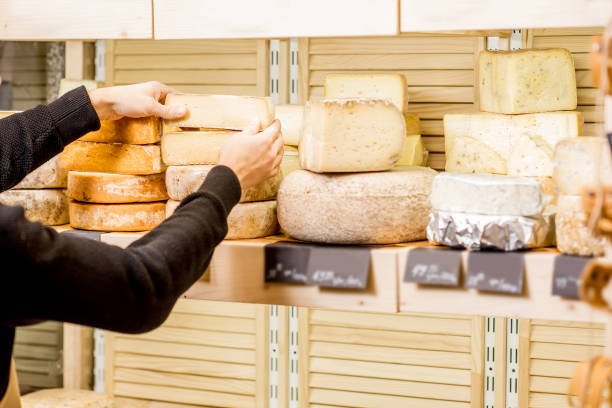 istock Cheese seller at the shop 886205982