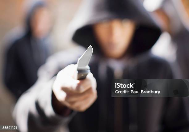 Man Threatening With Pocket Knife Stock Photo - Download Image Now - Knife - Weapon, Violence, Penknife