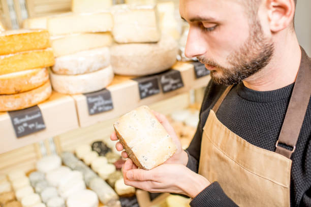 istock Holding a blue cheese at the store 886214542