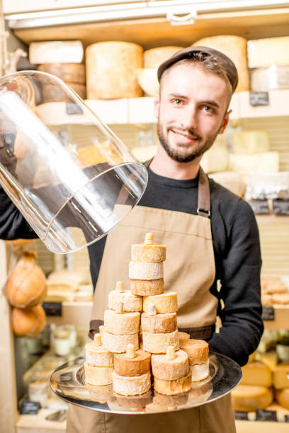 istock Cheese seller at the shop 886214862