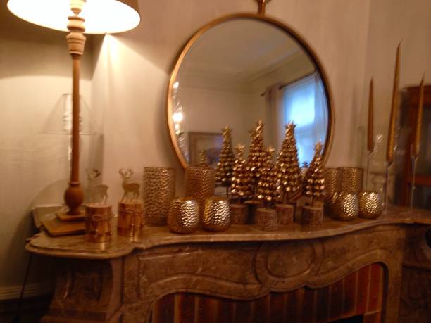 Interior with mirror, candles and christmas decoration in gold